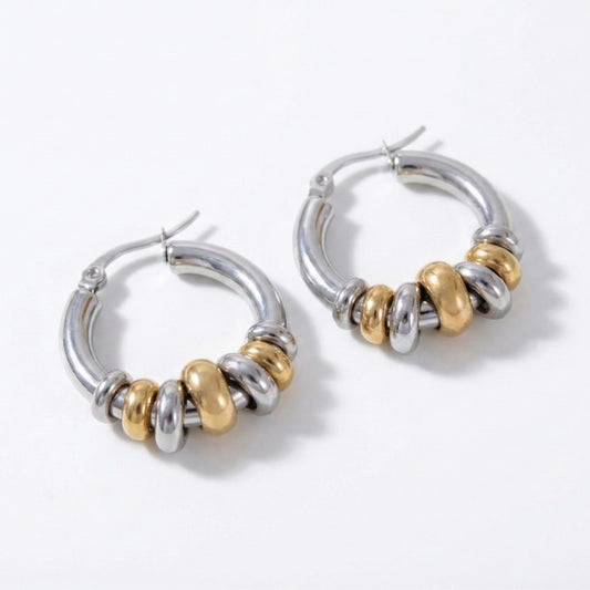Glow Petal luxury anti-tarnish mixed metal hoop earrings featuring alternating gold and silver rings on a white background