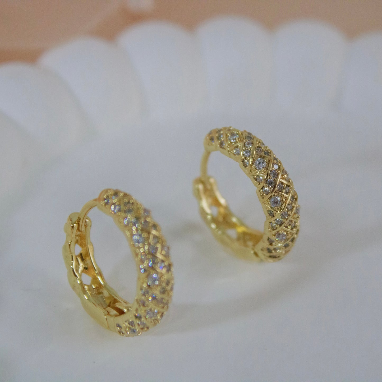 Waterproof gold jewelry quilted design earrings close up