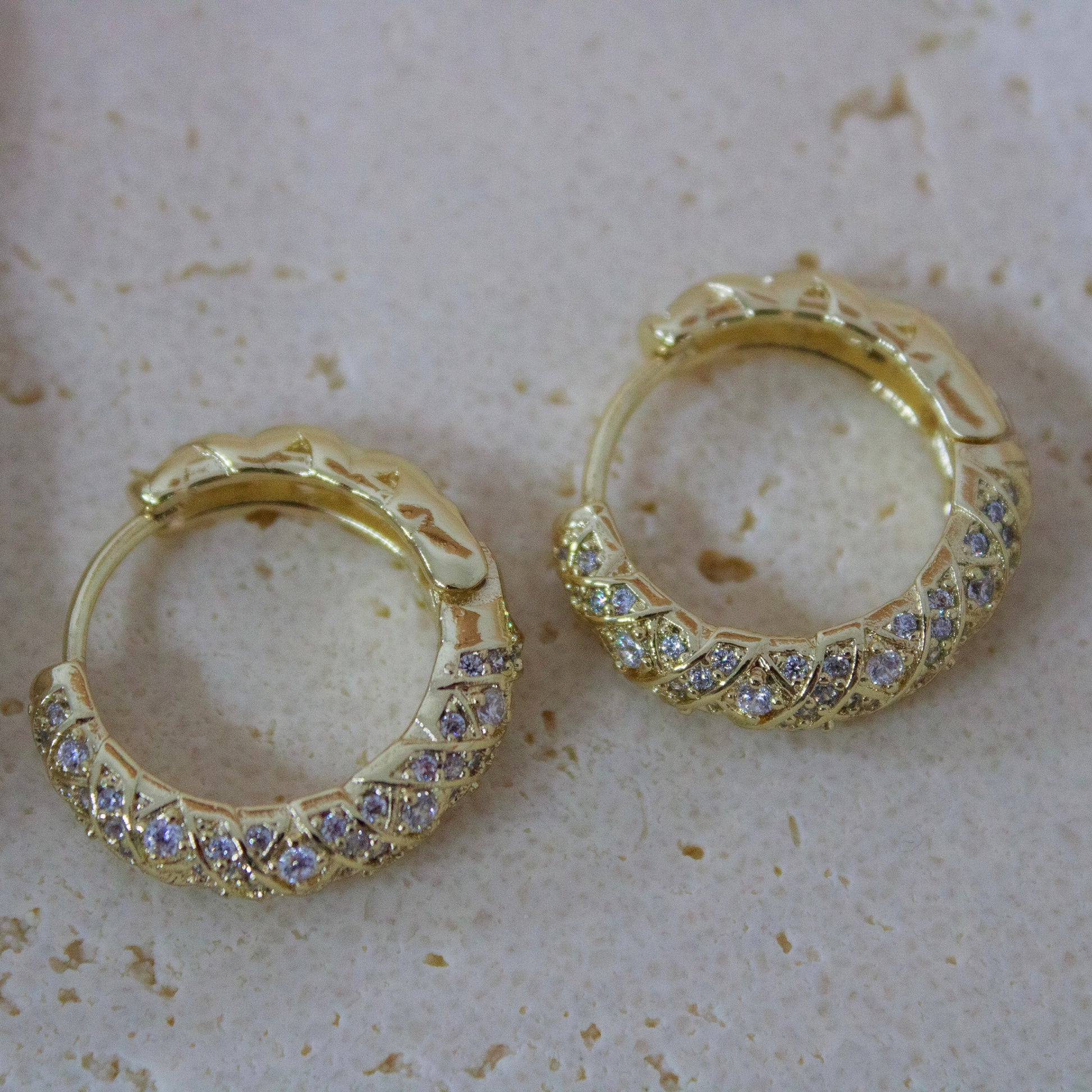 Anti-tarnish gold hoops textured with cubic zirconia stones
